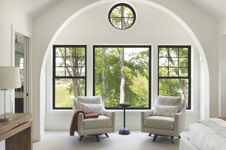 Living room with black 100 Series double hung windows
