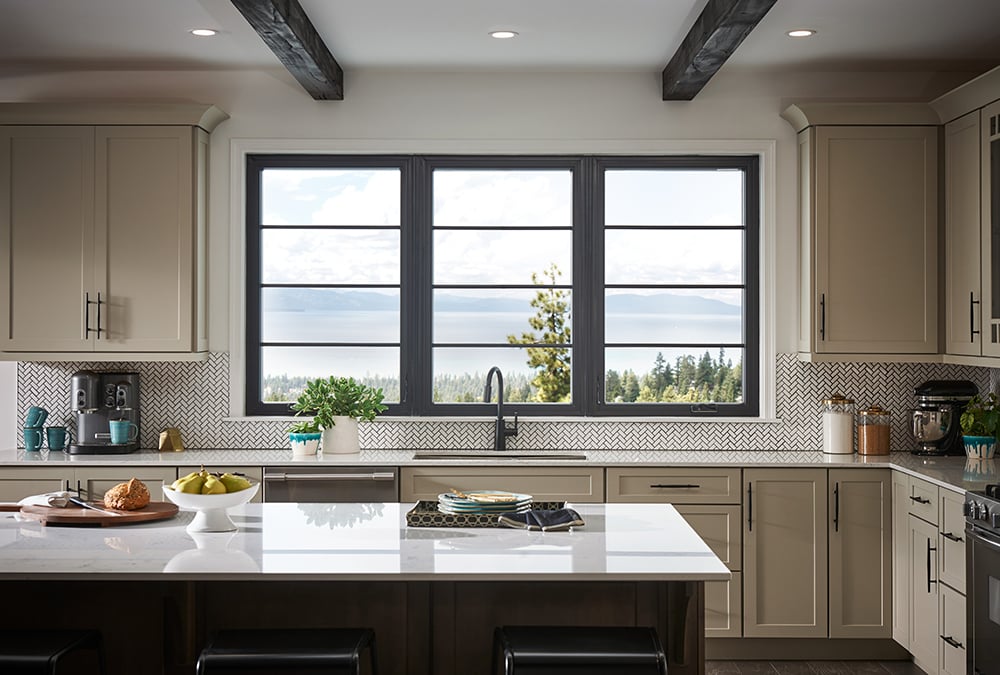 Beautiful kitchen with 100 Series triple-pane windows over looking stunning mountain view