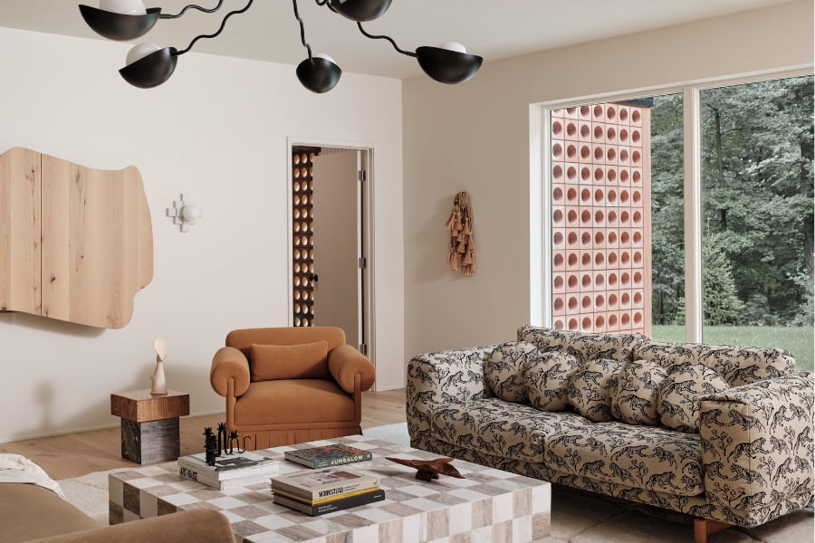 Trendy retro vintage living room with colorful sofa and checkered coffee table