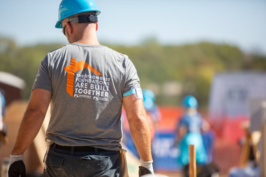 Construction worker wearing a shirt that says ‘The Strongest Foundations are Built Together.’