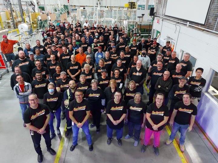 Andersen employees gather for photo in plant
