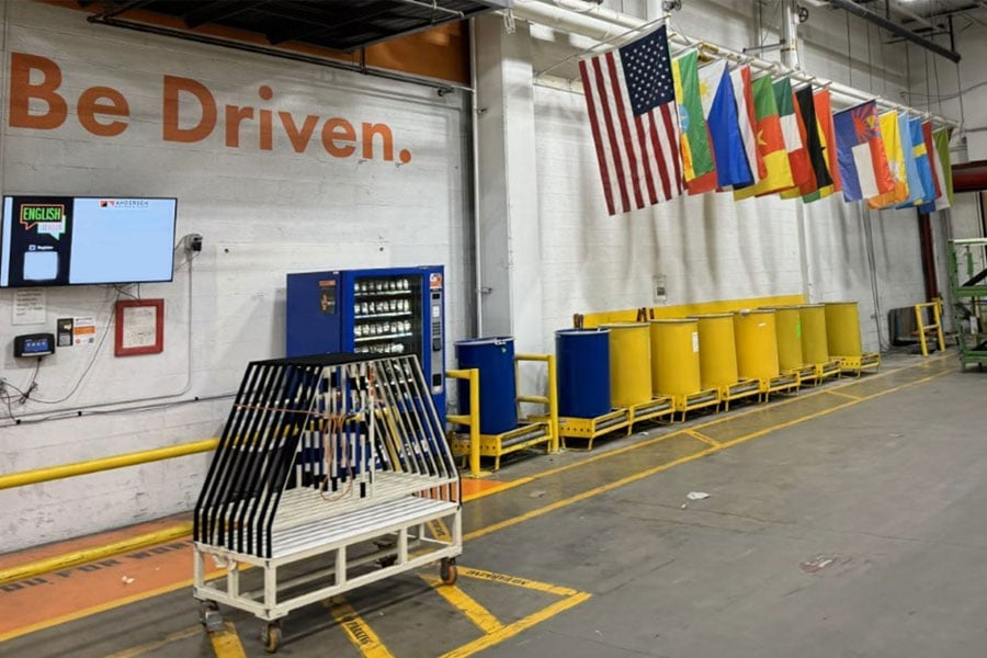row of flags on the wall in manufacturing plant