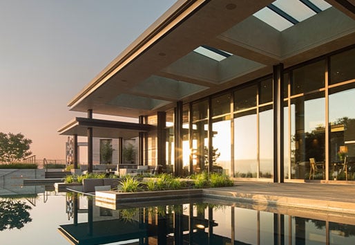 image of exterior pool area with Andersen big doors