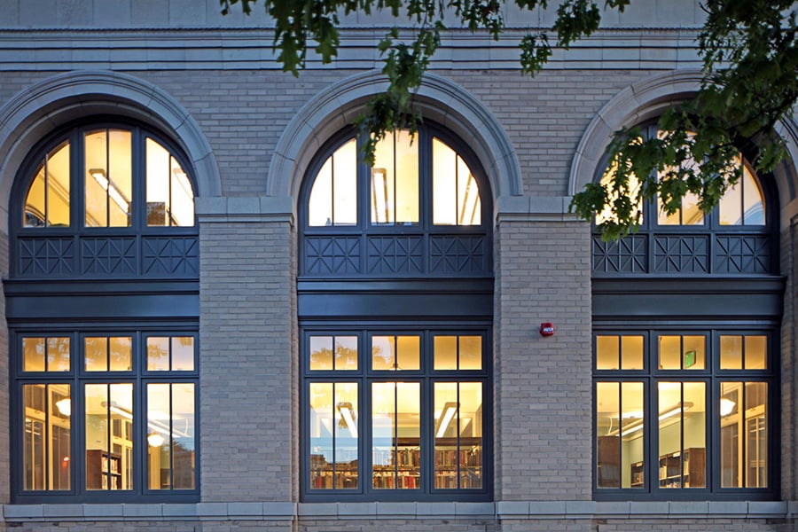 Dark arched windows on a classic brick building