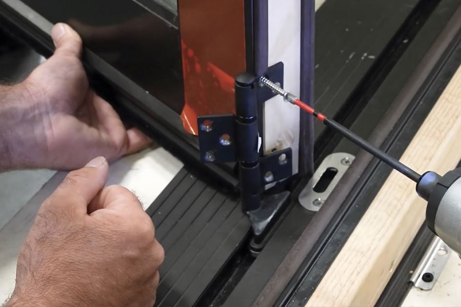 Close up of screws being applied to Big Door install job