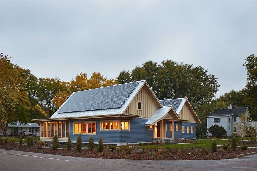 Hanson home exterior with golden lit windows at dusk