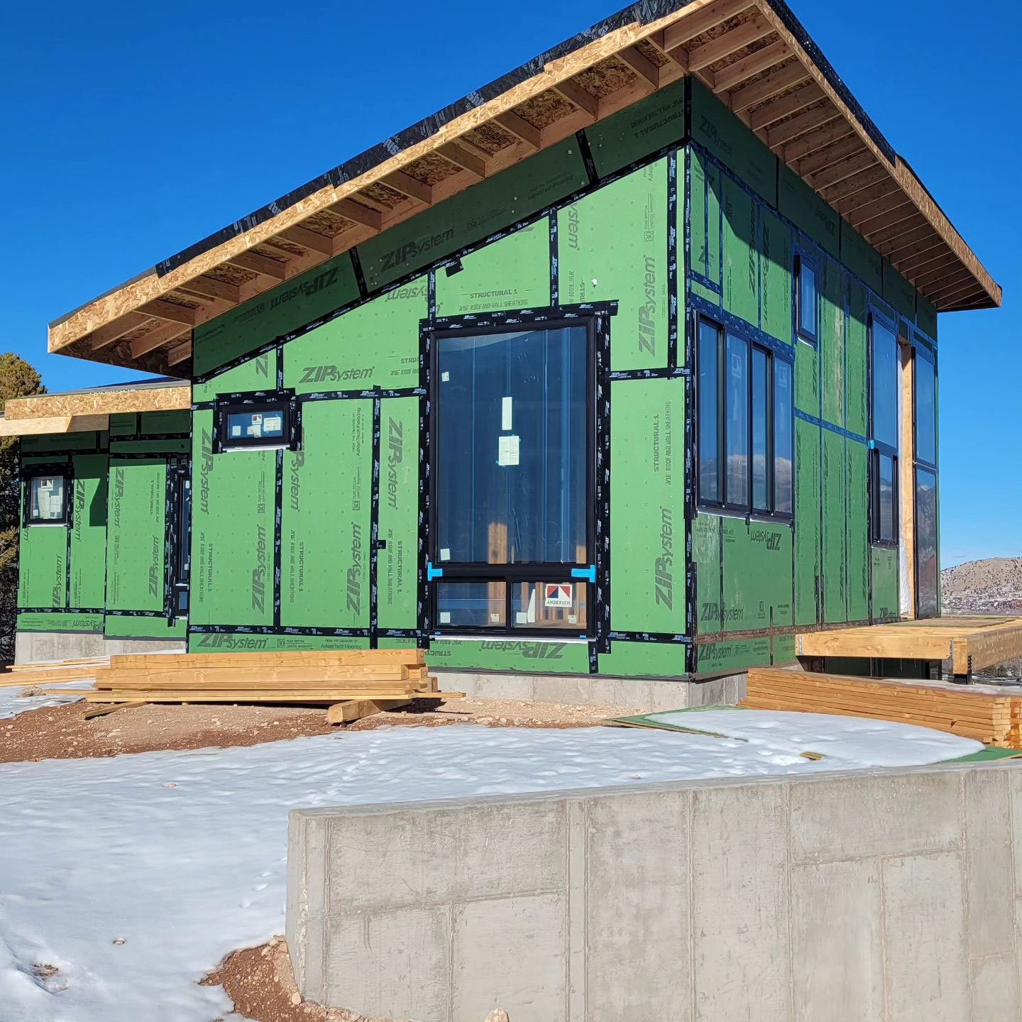 home with Zip System, an example of a factory-adhered WRB