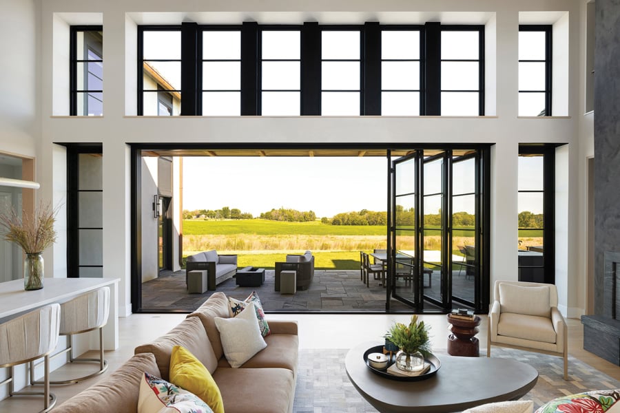 Best sliding glass doors: Black sliding doors looking out to a field in a modern home.
