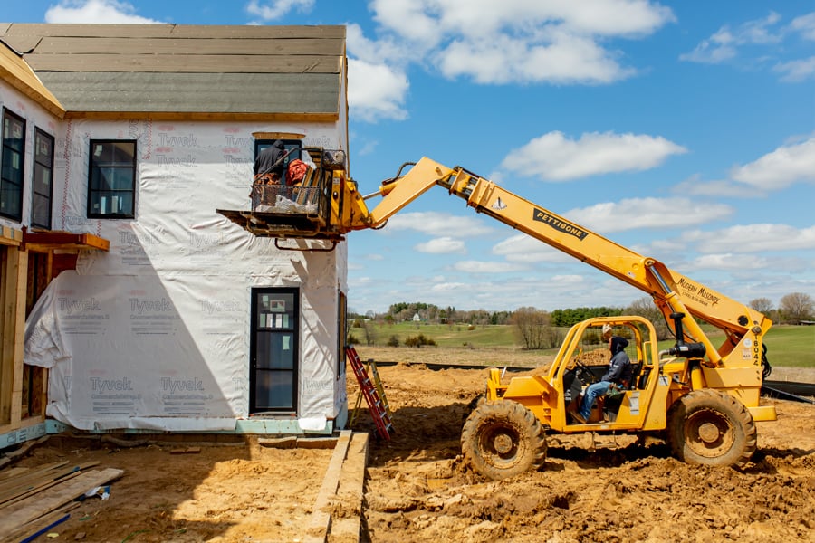 Windows being installed in a new construction home.