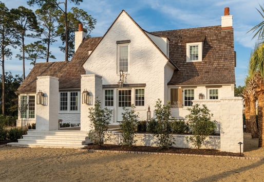 Classic Craftsman Bungalow with white windows with grilles