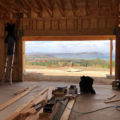 construction view of large opening for door to be installed leading outside