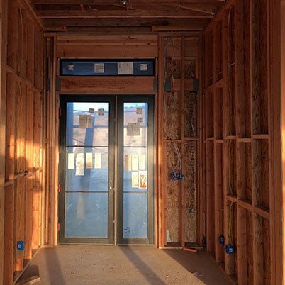 front entry of newly constructed home with black framed door