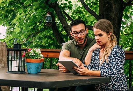Create a Budget - Home Remodeling Tips - couple consulting on ipad