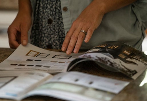Tips for remodeling your home: customer looking through brochure