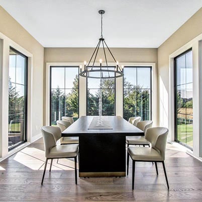 Oversized black windows in dining room, indoor outdoor living