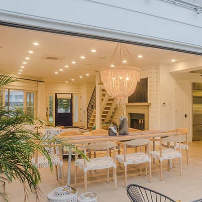 Indoor outdoor living dining room with bohemian style and furniture