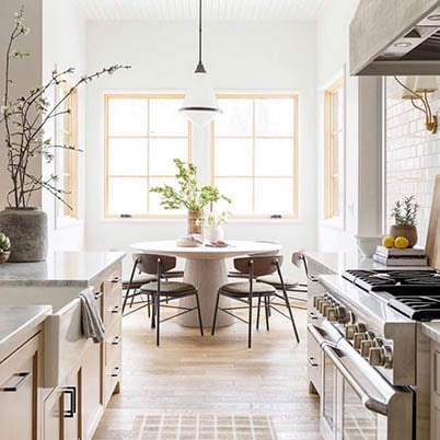 Kitchen and dining room white and wood with bohemian elements