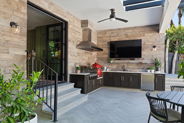outdoor kitchen, which is just beyond the patio door.