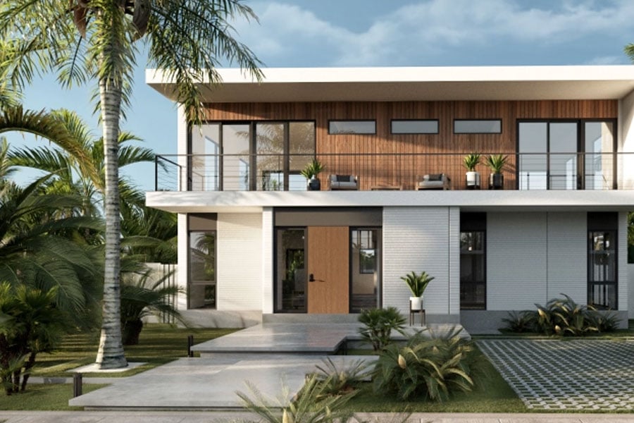 exterior view of small white home with lots of windows