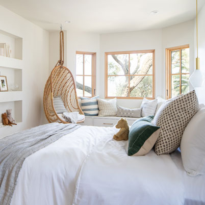 white bedroom with light wood accents