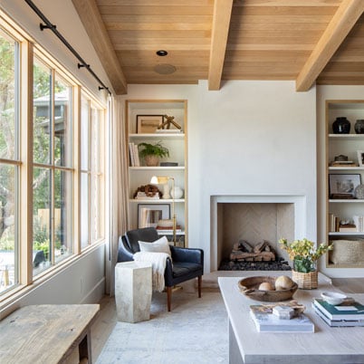 modern livingroom with wood ceiling and modern fireplace