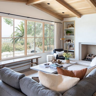 white family room with light framed wood windows and modern furniture