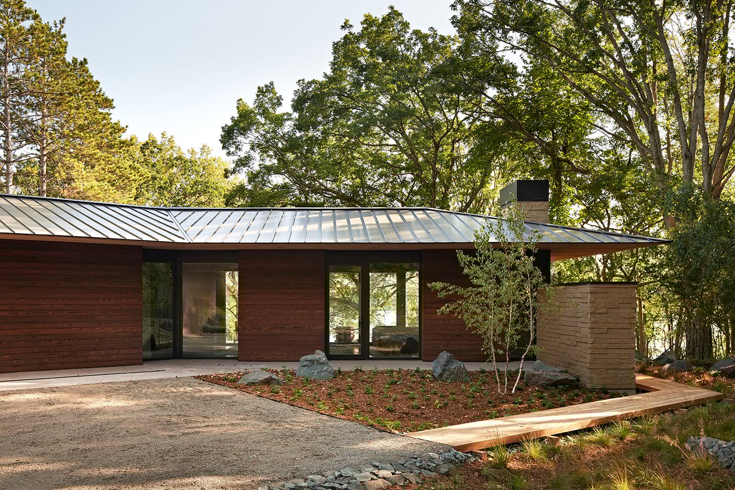 An exterior shot of a home with views of the lake.