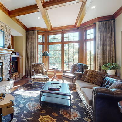 Andersen Windows Project Iverson Home Living Room with Wood A-Series Casement and Picture Windows