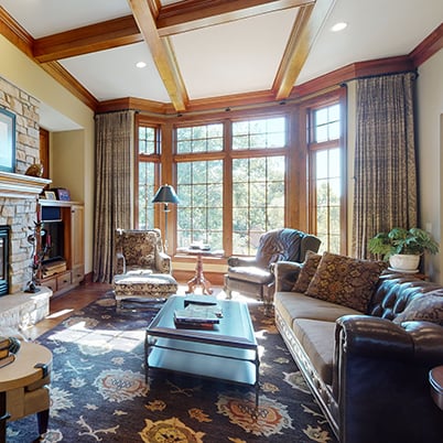 Andersen Windows Project Iverson Home Living Room with Wood A-Series Casement and Picture Windows