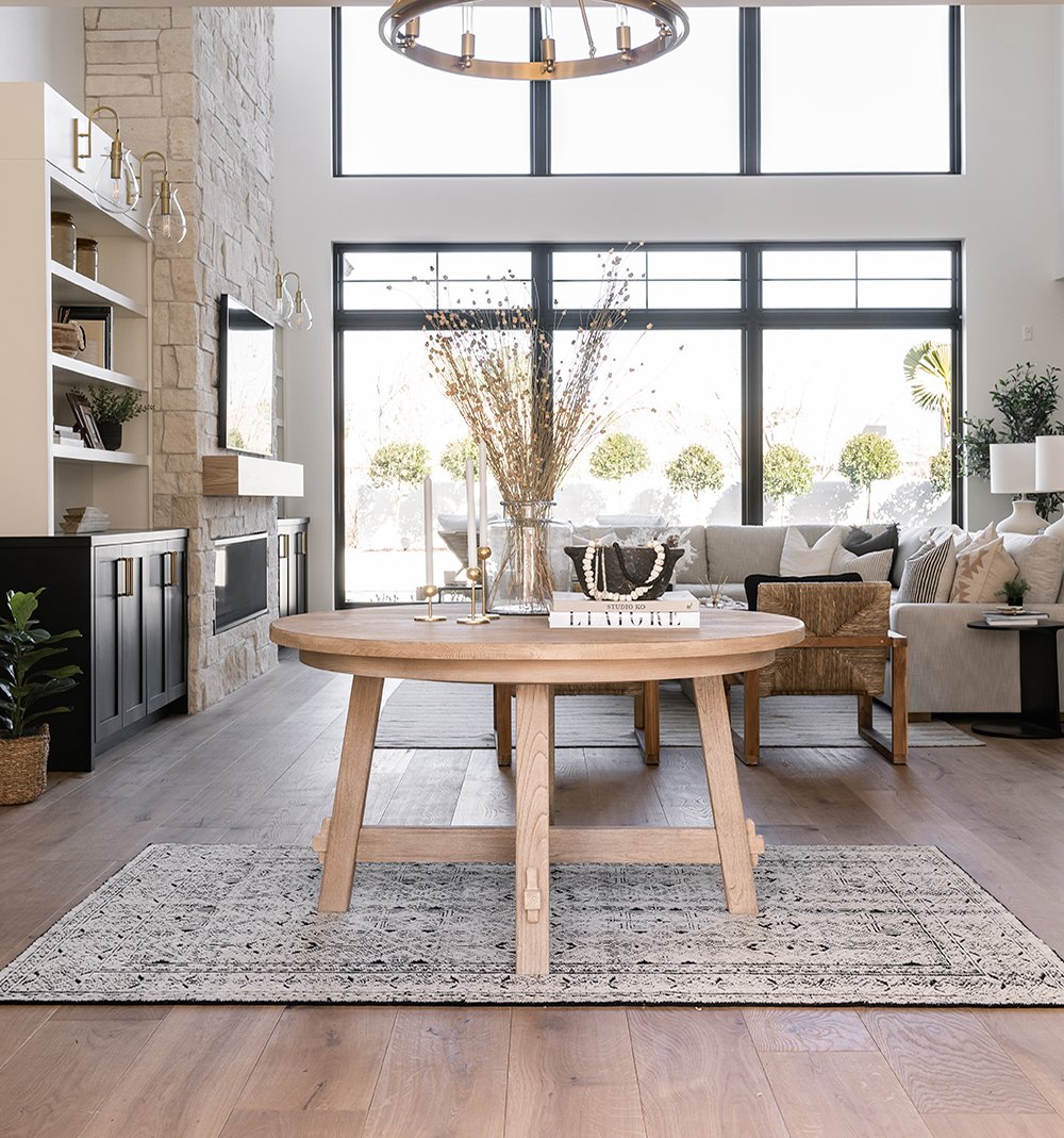 A wall of Andersen 100 Series windows brings a flood of natural light into the living room.