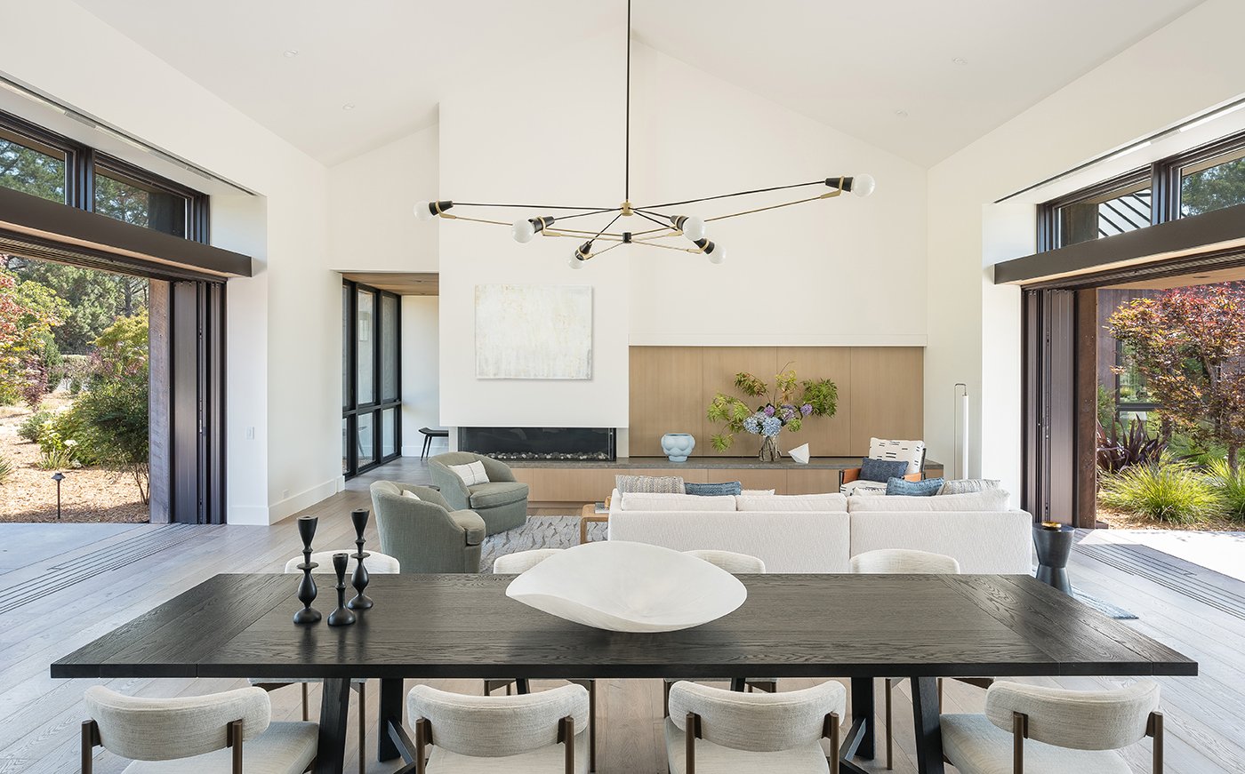 A living room opens on either side with Andersen® Liftslide doors. 