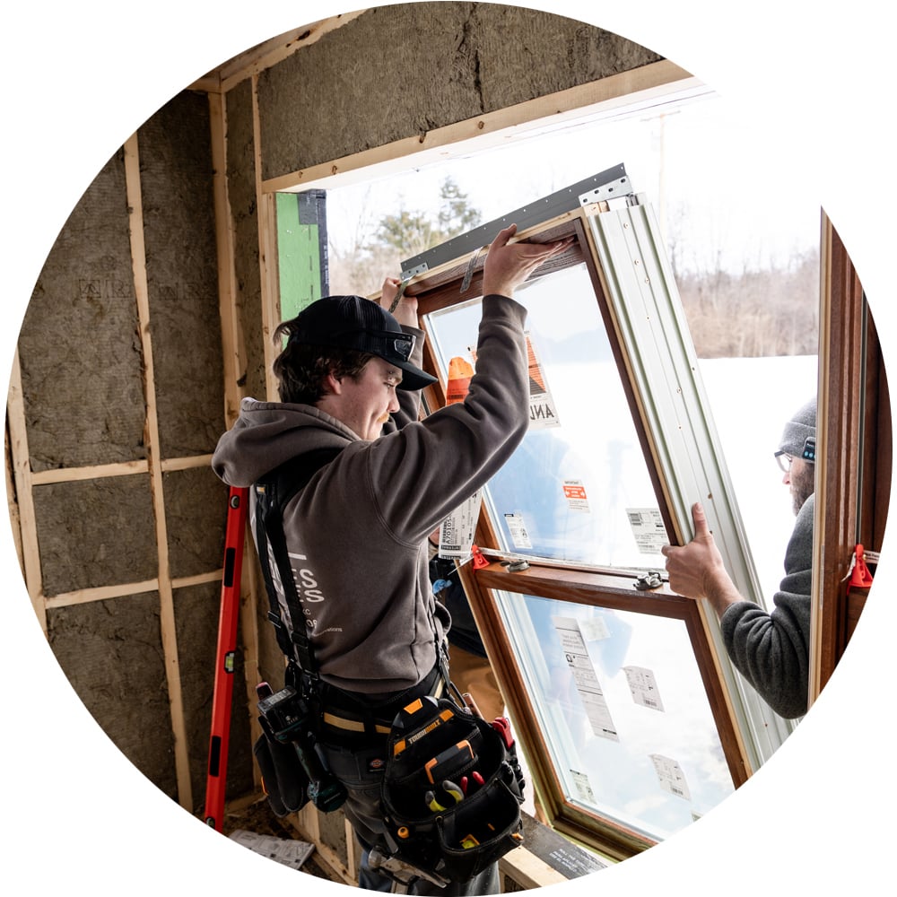 Contractor installing window