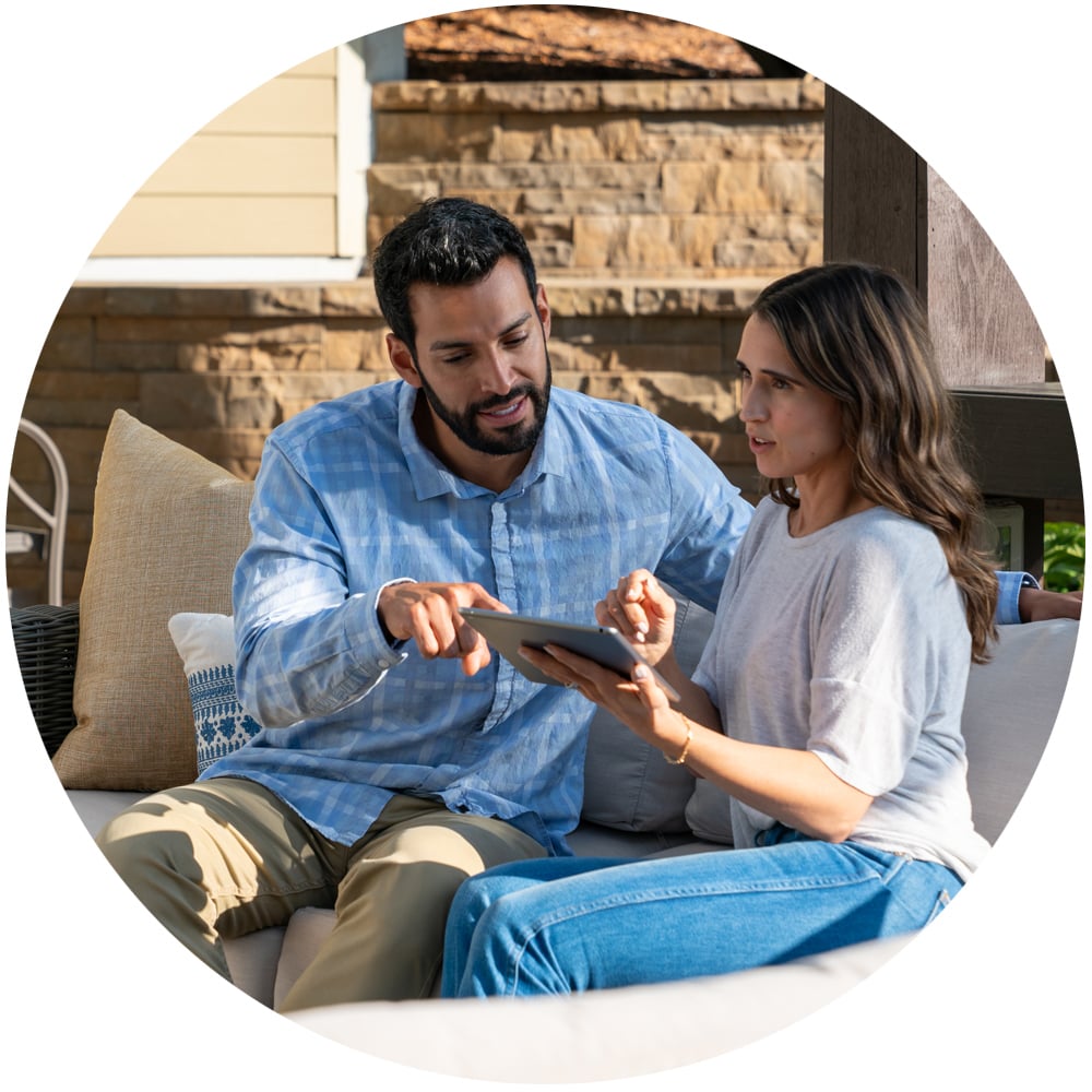 Couple looking at an iPad together