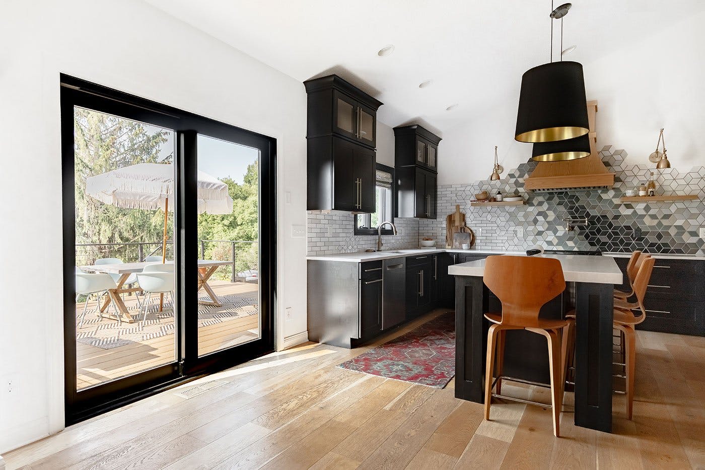 The back of Morgan Molitor’s home features her kitchen and a black-framed sliding patio door.