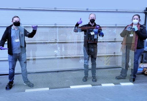 andersen employees in front of solar glass