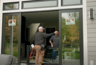 two contractors installing andersen a series contemporary doors