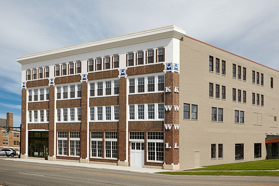 Historic downtown building in Iowa showcasing Andersen E-Series single-hung and stationary picture windows.