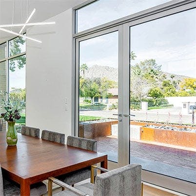 dining room with city view and andersen aluminum hinged door