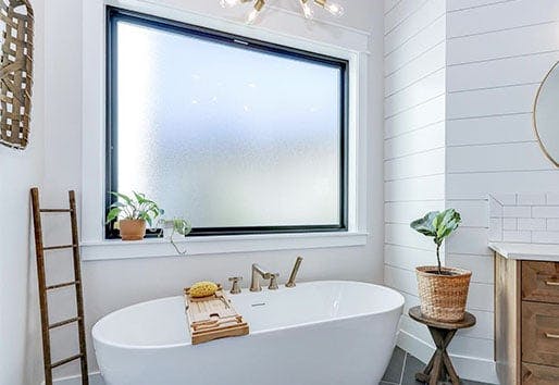 bathroom with black framed Andersen window with privacy glass