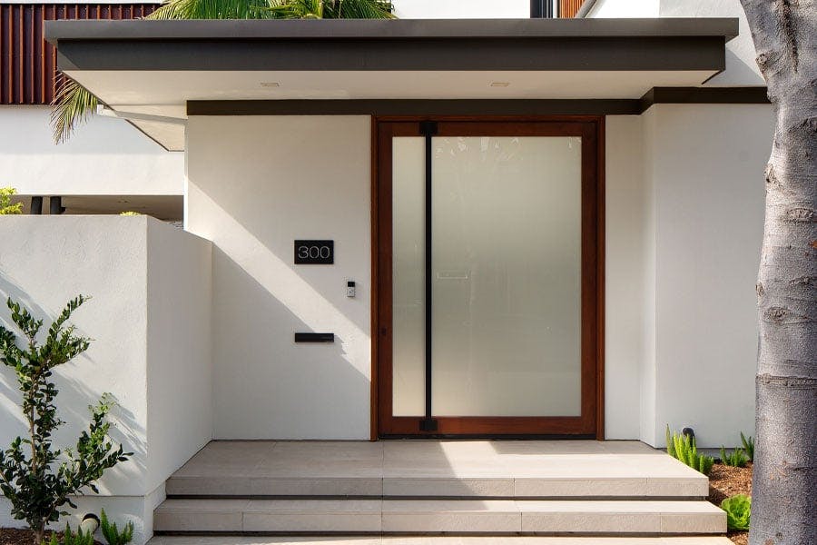 big door with privacy glass at entrance of modern home