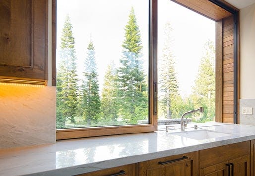 closeup view of andersen wood pass through window in kitchen