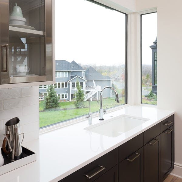 Kitchen with Andersen 400 Series Picture windows with black and white painted window frames