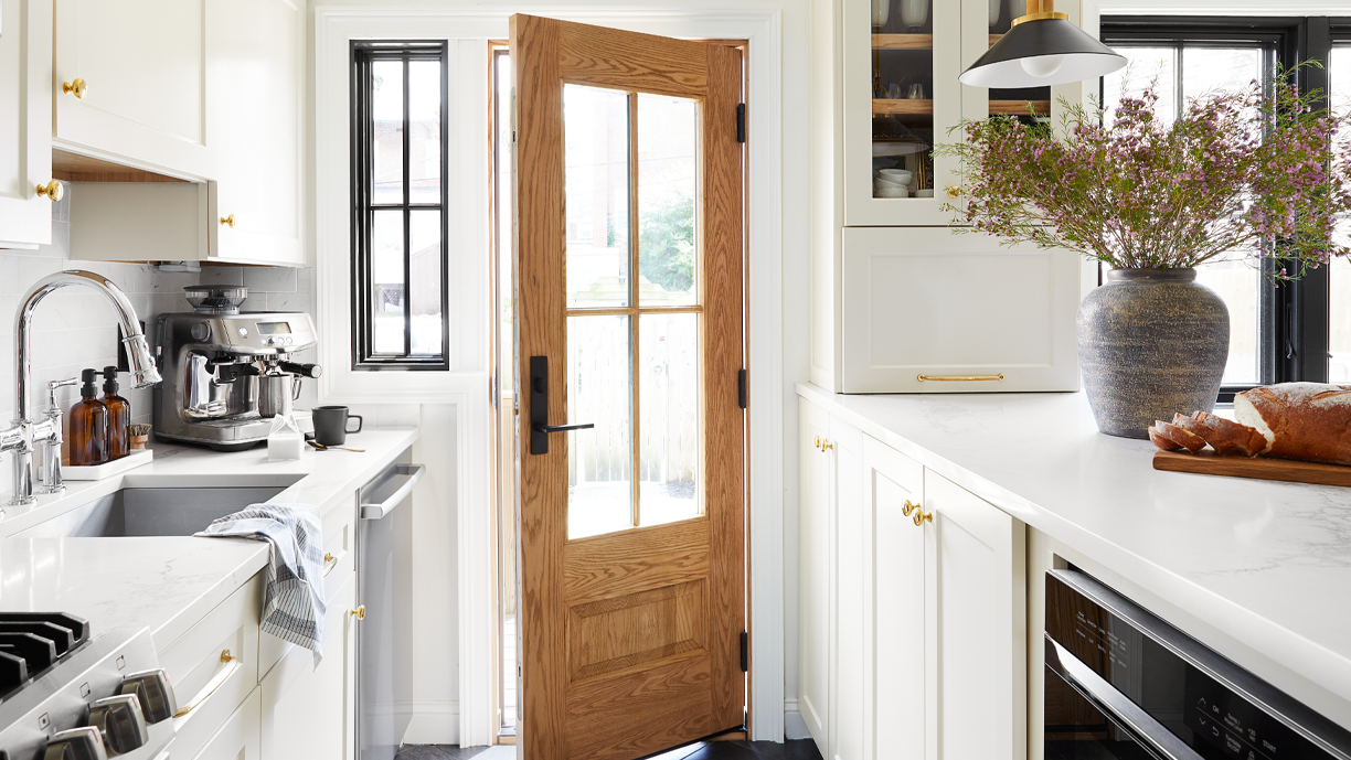 white kitchen with brown Andersen entry door